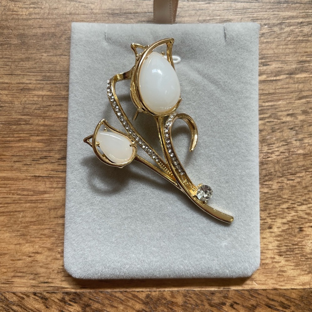 Elegant Gold and White Floral Brooch
